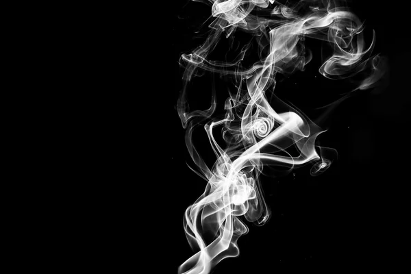 Smoke swirls on black background.