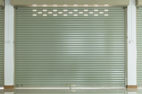 Aluminium steel metal roller shutter door in warehouse building