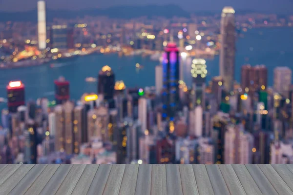 Opening wooden floor, Night blurred bokeh lights of Hong Kong city