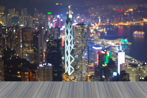 Opening wooden floor, Blurred lights night view of Hong Kong business downtown from victory peak view, abstract background
