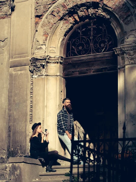 Fashionable couple near old building