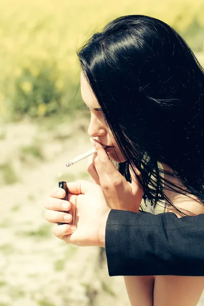 Beautiful woman smoking cigarette