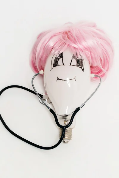 Bulb in wig with stethoscope