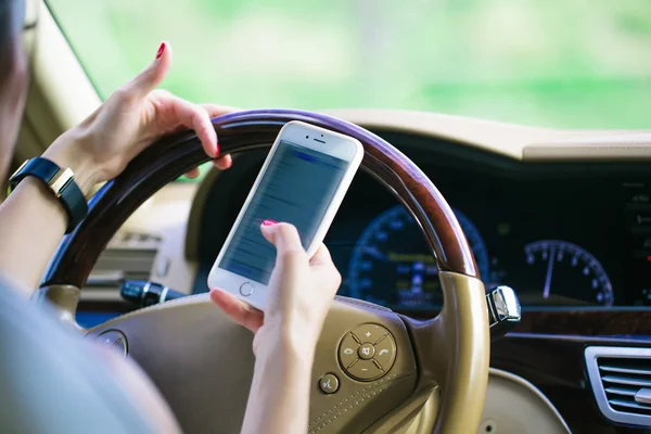 Hands with smartphone and watch