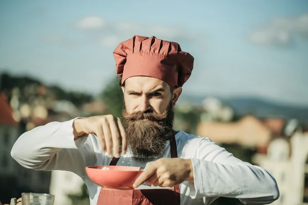 Man cook chef pouring floor