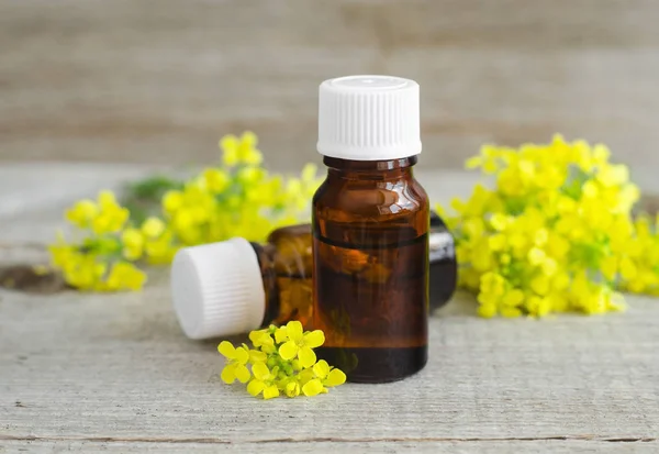 Two small bottles of natural essential oil (herbal or flowers extract, tincture, perfume)