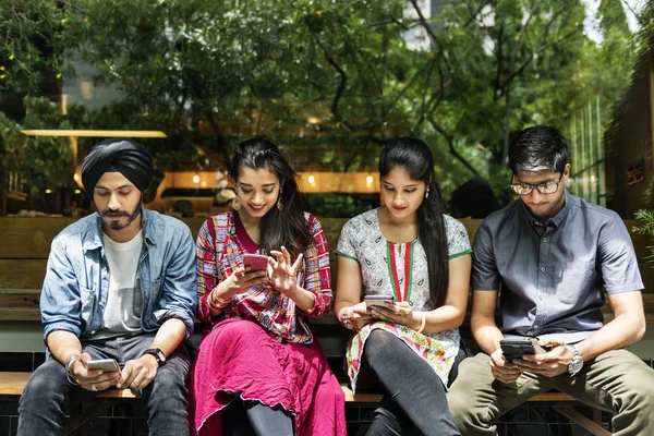 Indian friends with digital gadgets