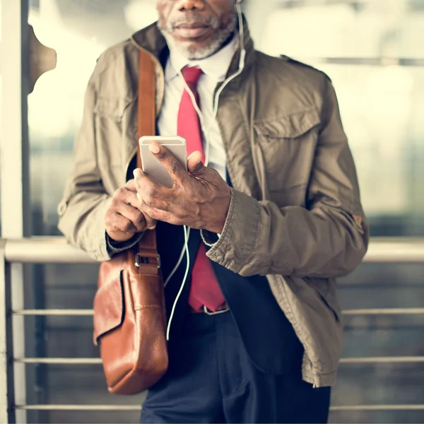 Man in Overcoat in Transport Terminal