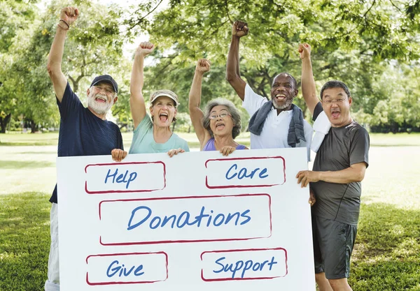 Senior Friends holding board