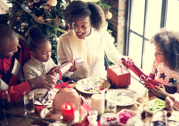 Family at table with a festive dinner