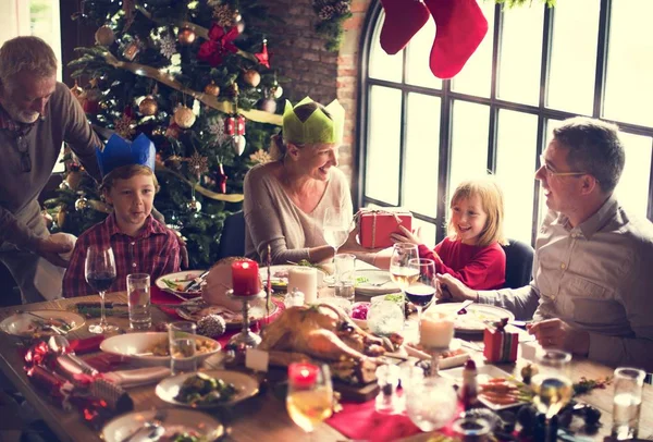 Family at table with a festive dinner