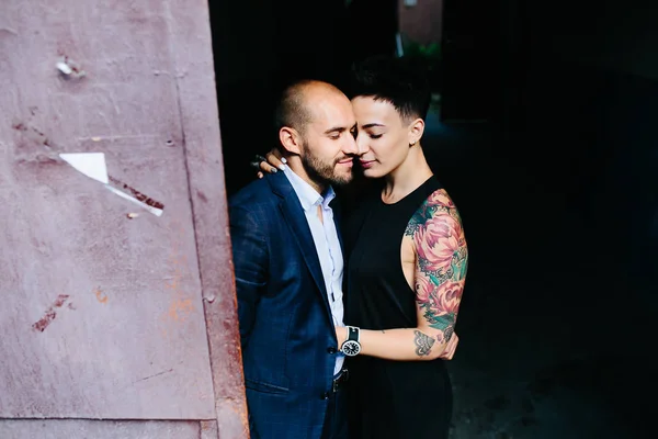 Man and woman hugging in the doorway