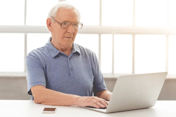 Old man with gadget