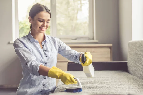 Woman cleaning her house