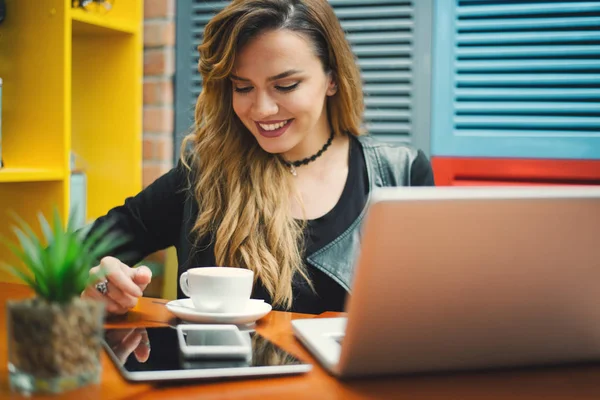 Attractive young woman at cafe