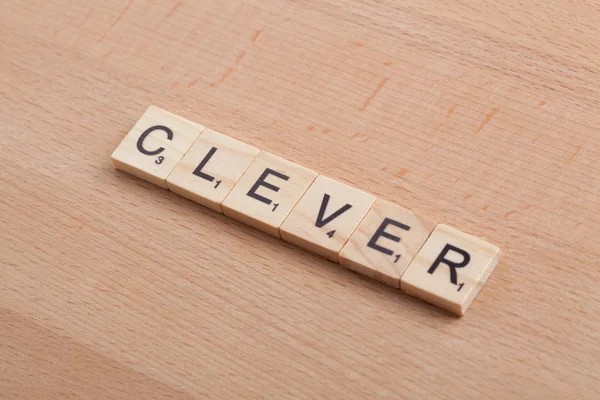 Scrabble letters spelling the word clever.