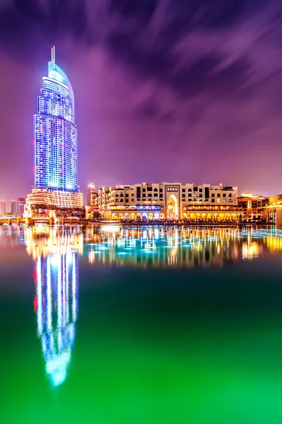 DUBAI, UAE - APR 7, 2013: Amazing night dubai downtown skyline with hotel The Address and traditional shop Souk Al Bahar, Dubai, United Arab Emirates