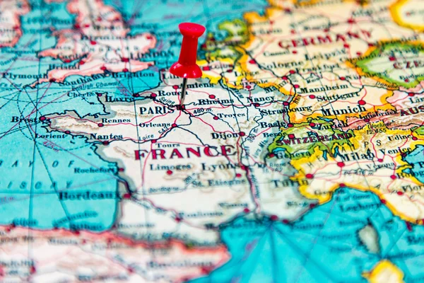 Paris, France pinned on vintage map of Europe