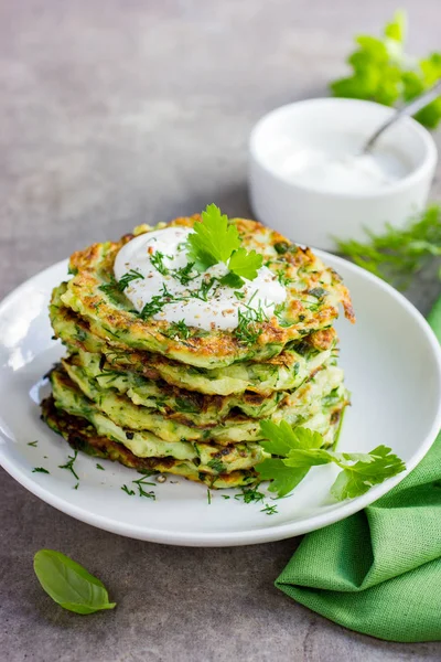 zucchini fritters, vegetarian zucchini pancakes, served with fr
