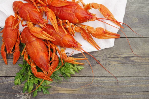 Boiled crawfish on a wooden background