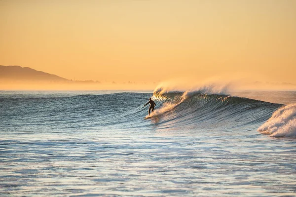 Dropping in on Autumn morning surf session.