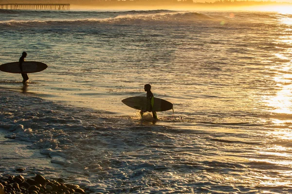 Shift change at Ventura beach