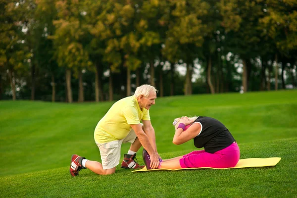 Senior woman doing physical exercise.