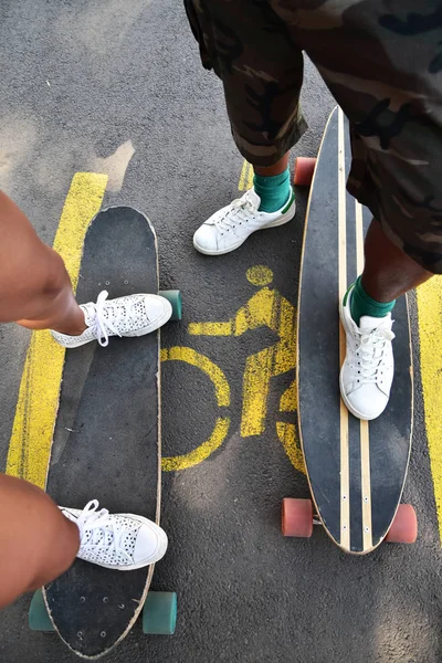Longboarding, skateboarding, fun sport in a city park