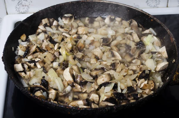 Cooking of mushrooms on a frying pan