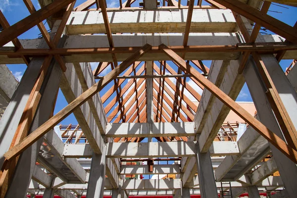 Low angle view of roof trusses and framing wooden of new house c