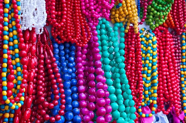 Colored wooden beads of various sizes and shapes