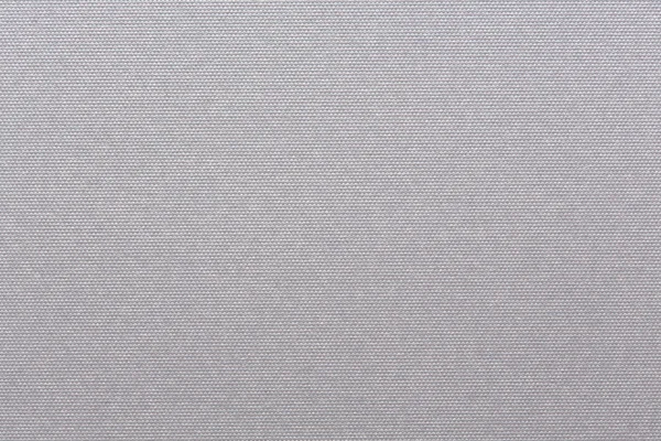 Embossed white paper with round pattern.