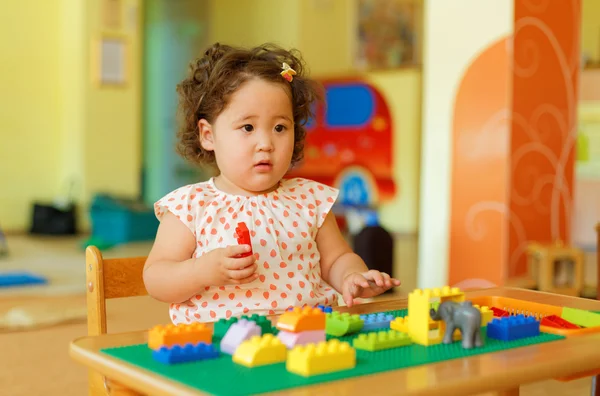 Hand of child playing in kids development center