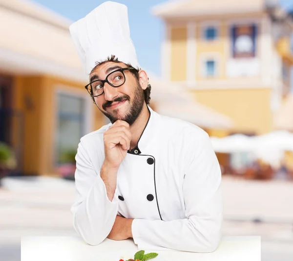 Cook man thinking with salad