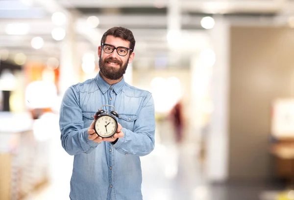 Happy young man with clock