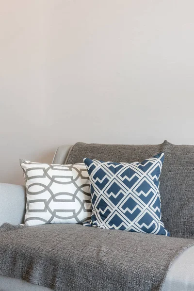 Set of pillows onmodern grey sofa in modern living room