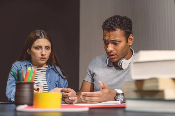 College students sitting together and studying