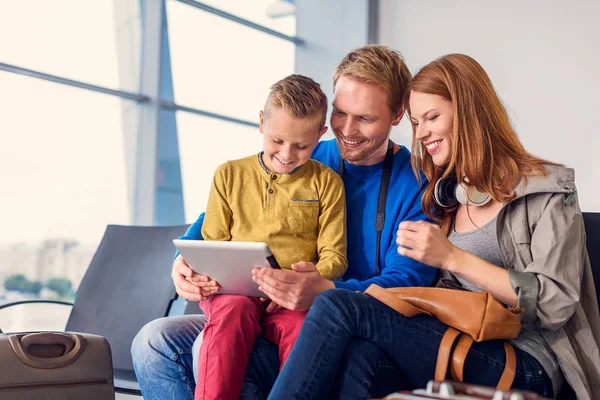 Family waiting for departure at airport