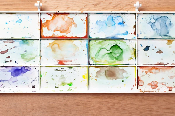 Watercolor paint tray. Art and abstract background.