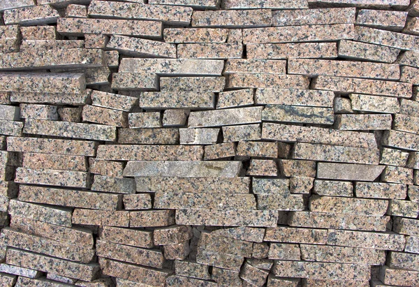 Wall of the small granite blocks