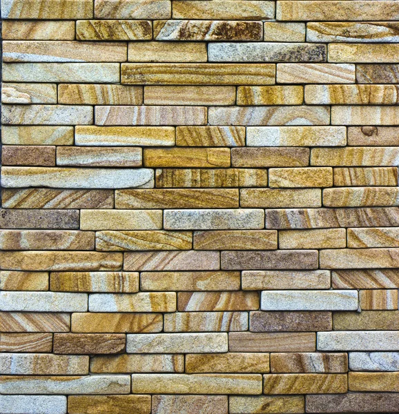 Texture of colored sandstone bricks close-up,