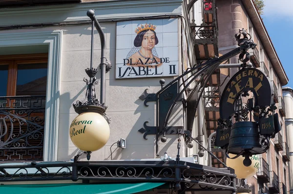 Closeup of the street sign. Plaza de Isabel II. Madrid, Spain.