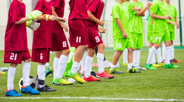 Football match for children. Training and football soccer tournament. Children stand in a row