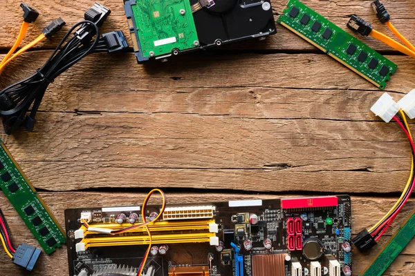 Computer hardware on a wooden background mockup