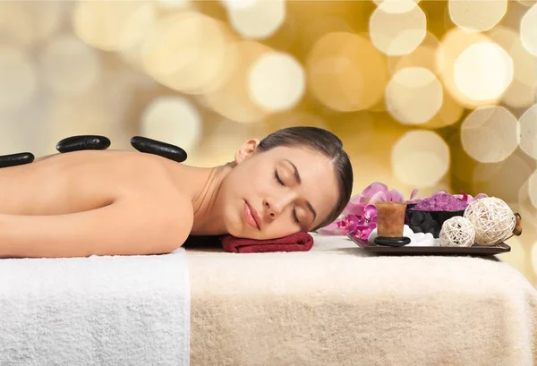 Woman relaxing in spa salon