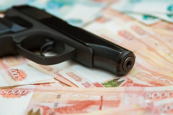 Black gun lies on the Russian big money