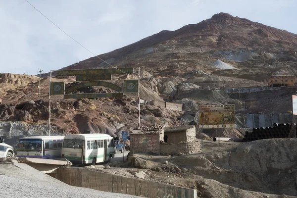 Buses with Workers Going Through the Entrance of Cerro Rico Silver Mine in Potosi, Bolivia