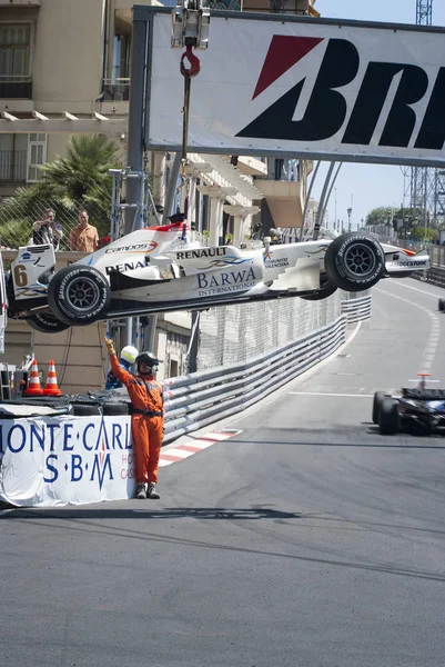 Formula 1 car being taken out of the race at Grand Prix of Monaco