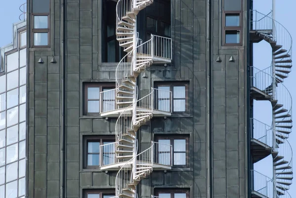 Emergency fire escape staircases on a building exterior.