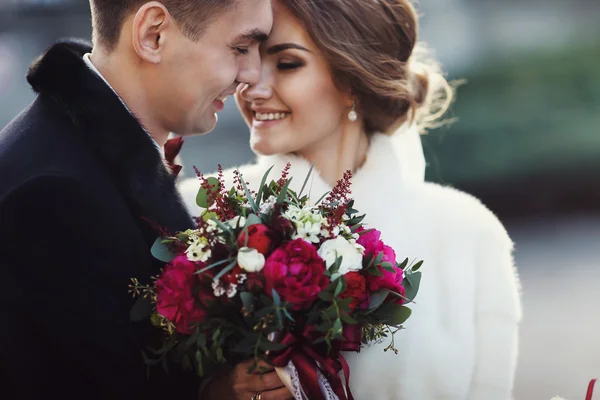 Newlyweds touch each other with noses